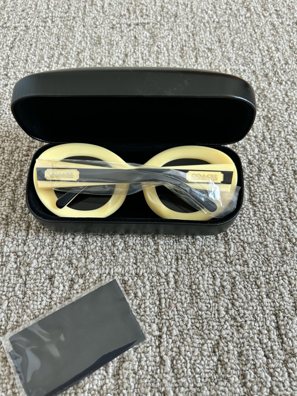 Coach Round Pale Yellow Frame Sunglasses with Black Temples